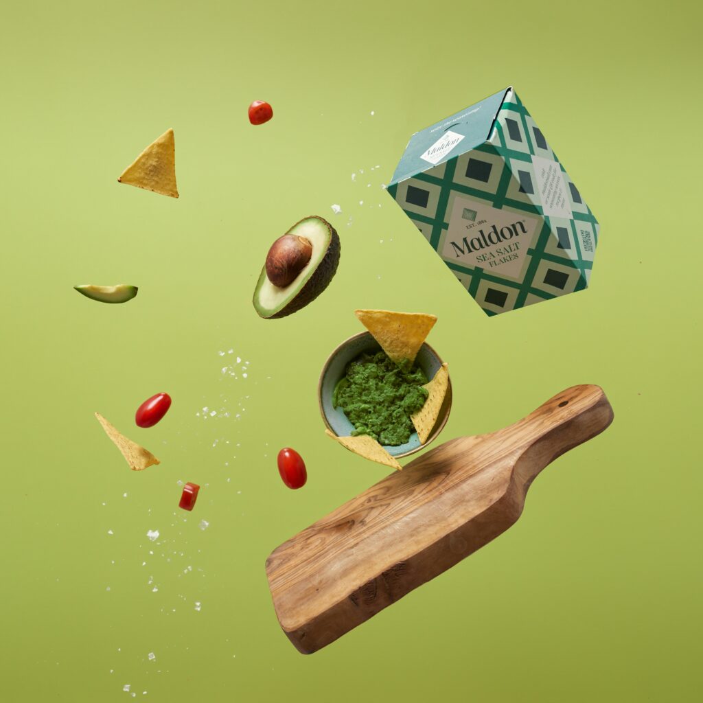 Food items ad chopping board in a photographic floating shot